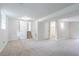 View of the living room showcasing a staircase and doorway to the bathroom at 2110 Redbud Sw Ct, Marietta, GA 30008