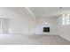 Bright and airy living room with a painted brick fireplace at 2110 Redbud Sw Ct, Marietta, GA 30008