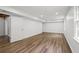 Spacious basement showcasing wood floors and white paneled walls at 2340 Castleridge Ct, Tucker, GA 30084