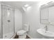 Basement bathroom featuring a toilet, sink, shower, and modern fixtures at 2340 Castleridge Ct, Tucker, GA 30084