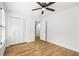 Bedroom showcasing hardwood flooring, ample closet space, and neutral paint, creating a serene atmosphere at 2340 Castleridge Ct, Tucker, GA 30084