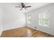 Cozy bedroom features hardwood flooring, natural light, and neutral walls at 2340 Castleridge Ct, Tucker, GA 30084
