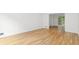 Bright dining room featuring hardwood floors and a view into the adjacent living area at 2340 Castleridge Ct, Tucker, GA 30084