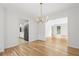 Open-concept dining room and kitchen featuring hardwood floors and recessed lighting at 2340 Castleridge Ct, Tucker, GA 30084