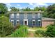 Traditional two-story home with blue siding, manicured lawn, and mature landscaping at 2340 Castleridge Ct, Tucker, GA 30084