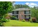 Two-story home featuring brick and siding on a landscaped lot at 2340 Castleridge Ct, Tucker, GA 30084