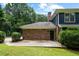 Brick and siding home exterior, with well-maintained backyard at 2340 Castleridge Ct, Tucker, GA 30084