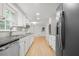 Bright kitchen with stainless steel appliances, granite countertops, and modern lighting at 2340 Castleridge Ct, Tucker, GA 30084