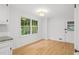Eat-in kitchen with natural light, hardwood floors, granite countertops and a modern light fixture at 2340 Castleridge Ct, Tucker, GA 30084