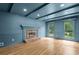 Bright living room with hardwood floors, coffered ceilings, fireplace, and ample natural light at 2340 Castleridge Ct, Tucker, GA 30084