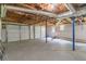 Unfinished basement with exposed ceiling and concrete floor offering potential for customization at 243 Hickory Way, Canton, GA 30115