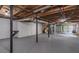 Large unfinished basement with exposed utilities, with stairs and door leading outside at 243 Hickory Way, Canton, GA 30115