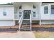Close-up of the front porch, door and new landscaping at the entrance at 243 Hickory Way, Canton, GA 30115