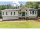 Charming renovated home with a gabled roof, front porch and manicured front lawn at 243 Hickory Way, Canton, GA 30115