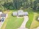 Aerial view of a home featuring a well-kept lawn, two-car garage, and driveway at 3109 Albatross Ln, Decatur, GA 30034