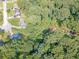 Aerial shot capturing a creek flowing through tree-lined residential properties at 3109 Albatross Ln, Decatur, GA 30034