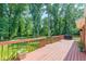 Relaxing on the expansive wooden deck with a grill, perfect for outdoor entertaining at 3109 Albatross Ln, Decatur, GA 30034
