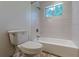 Modern bathroom featuring a shower-tub combination and horizontally stacked large format tiles at 3109 Albatross Ln, Decatur, GA 30034