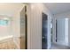 Bright bathroom boasts white tiles, a tub/shower, and a patterned tile floor at 3109 Albatross Ln, Decatur, GA 30034