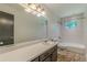 Bright bathroom featuring a shower-tub combination, tiled walls and neutral colored countertop at 3109 Albatross Ln, Decatur, GA 30034