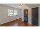 Bedroom with hardwood floors, white walls, and closet space at 3109 Albatross Ln, Decatur, GA 30034