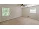 This bedroom boasts ample natural light from the two windows with a ceiling fan overhead at 3109 Albatross Ln, Decatur, GA 30034