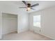This bedroom offers a closet, a window with blinds and neutral carpeting at 3109 Albatross Ln, Decatur, GA 30034