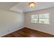 Bright bedroom features hardwood floors, white walls, and natural light from a double window at 3109 Albatross Ln, Decatur, GA 30034
