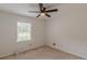 Bedroom with a ceiling fan, a window with blinds, and neutral carpeting at 3109 Albatross Ln, Decatur, GA 30034