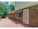 Enjoy outdoor living on this large wooden deck attached to a brick home at 3109 Albatross Ln, Decatur, GA 30034