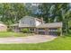 Charming home featuring a well-manicured lawn and a two-car garage at 3109 Albatross Ln, Decatur, GA 30034