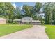 Charming home featuring a well-manicured lawn and a two-car garage at 3109 Albatross Ln, Decatur, GA 30034