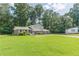 Charming home featuring a well-manicured lawn and a two-car garage at 3109 Albatross Ln, Decatur, GA 30034
