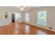 Spacious living room featuring hardwood floors, large windows, and ceiling fan at 3109 Albatross Ln, Decatur, GA 30034
