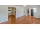 Open-concept living room with hardwood floors and a view to kitchen, staircase, and entryway at 3109 Albatross Ln, Decatur, GA 30034