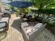Outdoor patio featuring comfortable seating and a shady umbrella, perfect for relaxation at 7825 Crownpoint Dr, Alpharetta, GA 30005