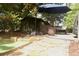 Serene backyard featuring a patio with ample seating under a shady umbrella at 7825 Crownpoint Dr, Alpharetta, GA 30005