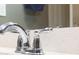 Close-up of bathroom faucet and countertop with a bright, clean, modern design at 7825 Crownpoint Dr, Alpharetta, GA 30005
