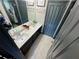 Contemporary bathroom with double sinks, quartz countertops, and modern fixtures at 7825 Crownpoint Dr, Alpharetta, GA 30005