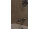 Close up of tiled showerhead and faucet at 7825 Crownpoint Dr, Alpharetta, GA 30005