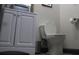 Clean, neutral bathroom featuring a modern toilet, gray vanity, and ample space at 7825 Crownpoint Dr, Alpharetta, GA 30005