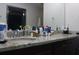 Bathroom vanity with granite countertops, and sinks, and ample counter space at 7825 Crownpoint Dr, Alpharetta, GA 30005