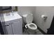 Cozy bathroom featuring a pedestal sink and toilet at 7825 Crownpoint Dr, Alpharetta, GA 30005