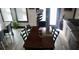 Dining room featuring a large dark wood table, six chairs, and wood-look floors at 7825 Crownpoint Dr, Alpharetta, GA 30005