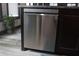 Sleek, stainless steel dishwasher integrated into the kitchen island for modern convenience at 7825 Crownpoint Dr, Alpharetta, GA 30005
