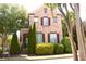 Lovely two-story brick home with well-maintained landscaping and traditional shutters at 7825 Crownpoint Dr, Alpharetta, GA 30005