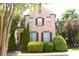 Charming brick home with manicured landscaping and classic architectural details at 7825 Crownpoint Dr, Alpharetta, GA 30005