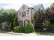 Beautiful brick home with manicured landscaping, offering curb appeal and charm at 7825 Crownpoint Dr, Alpharetta, GA 30005