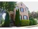 Charming brick home with manicured landscaping and a welcoming front entrance at 7825 Crownpoint Dr, Alpharetta, GA 30005