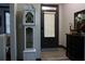 A stylish foyer features a grandfather clock and dark trim at 7825 Crownpoint Dr, Alpharetta, GA 30005